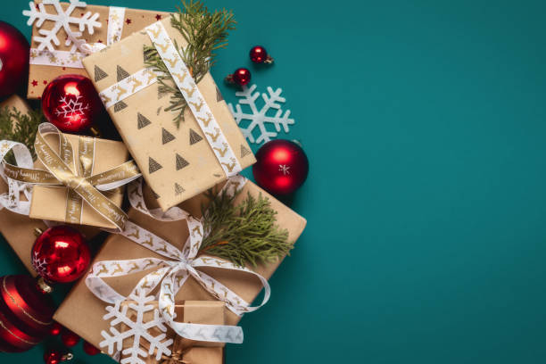 istock Gift boxes with bows and Christmas red balls top view 1711262789
