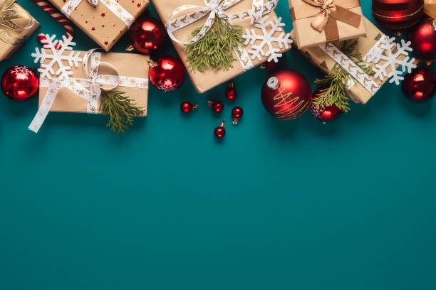 istock Gift boxes with bows and Christmas red balls top view 1711262803
