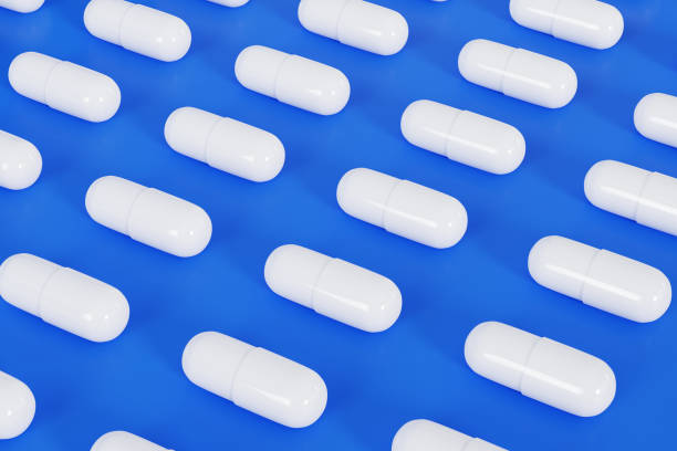 istock 3D Rendering medicine arranged in a row on blue background 1711262815