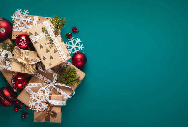 istock Gift boxes with bows and Christmas red balls top view 1711263874