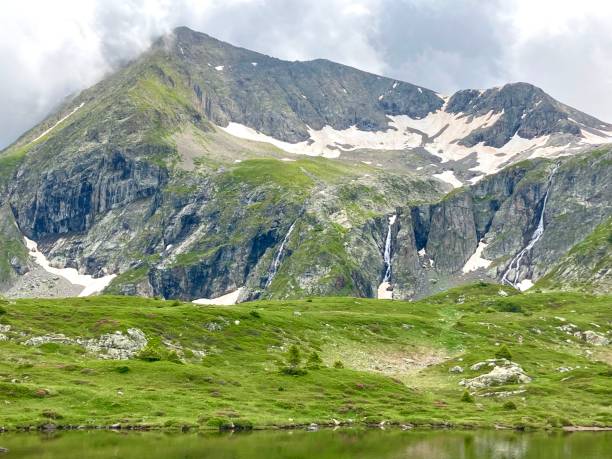 istock Waterfalls on snowy mountain top 1711268742