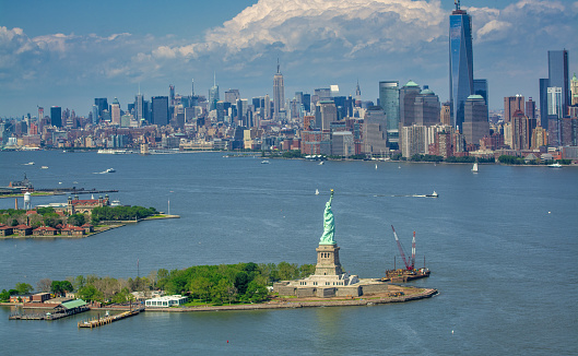 Ferry and Manhattan skyline with Empire State Building in background, New York City