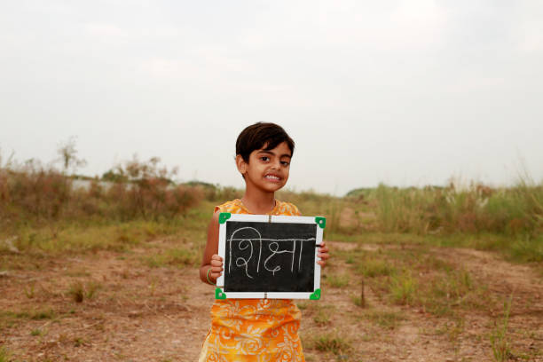 istock Elementary girl holding writing slate education concept 1711330468