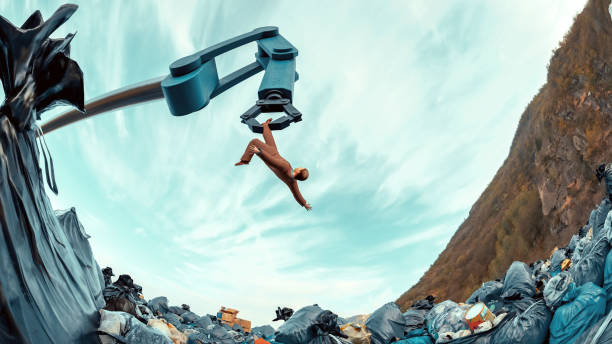Robotyczne ramię ustawione do wyrzucania człowieka na stos śmieci – zdjęcie