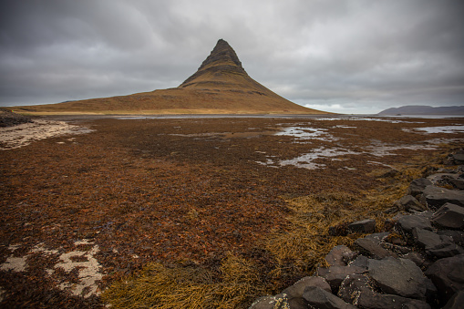 Kirkjufell  is a high hill on the north coast of Iceland's Snæfellsnes peninsula, near the town of Grundarfjörður.