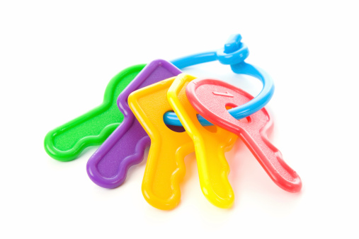 Bright, colorful, plastic baby keys isolated on white. Room for Copy. Selective focus.Find more isolated shots here...