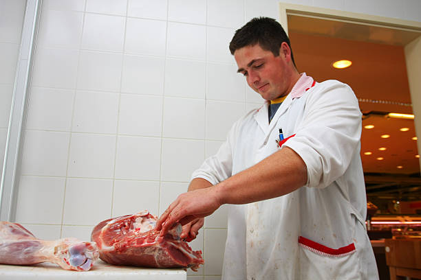 istock Butchery...Butcher is slicing veal thight 171136035