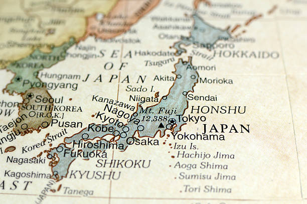 Antique map displaying Japan and surrounding areas A macro photograph of Japan from a desktop globe. Adobe RGB color profile. tokai region photos stock pictures, royalty-free photos & images