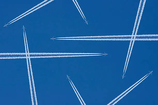 Airplanes in a Blue Sky with Vapor Trail, Air Traffic
