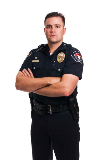 35 year old Police Officer with arms folded. Isolated in camera, not cut out. DRE pin stands for 'drug recognition expert', this is extra police training he has taken.Please see some similar pictures from my portfolio: