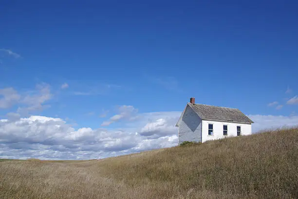 one-room school building in desolate rural setting.  Location:  North Dakota, USA