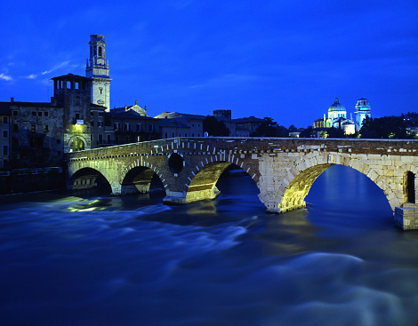 Ponte di Pietra in Verona, Italy during the night.