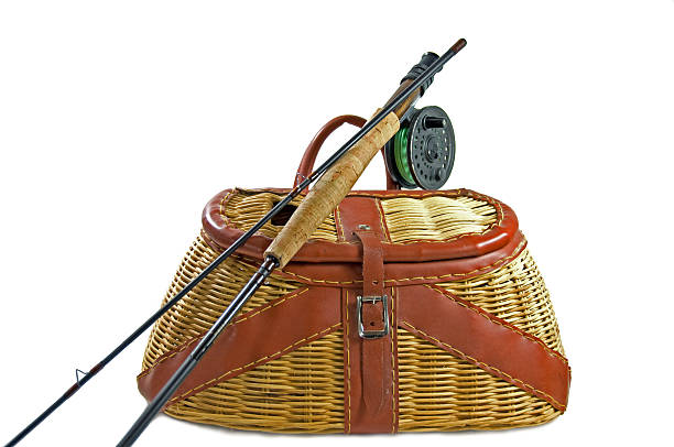 Fishing net and wicker fish creel antique outdoor sports equipment.