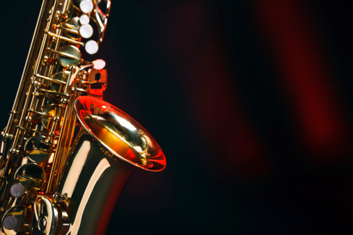 Alto saxophone on a red and black background with space for copy. Shot with Canon EOS 1Ds Mark III.