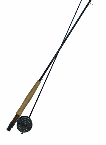 This flyfishing rod and reel have copy space on the white backbgound.
