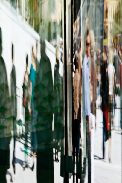 istock Reflections of people in a glass facade. 171136804