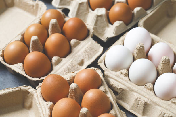 istock fresh chicken eggs for sale at a market. pattern background. 1711368050