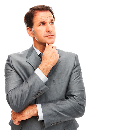 Close-up of a businessman thinking against white background