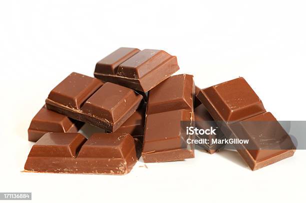 Chocolate Segments Stock Photo - Download Image Now - Milk Chocolate, White Background, Brown