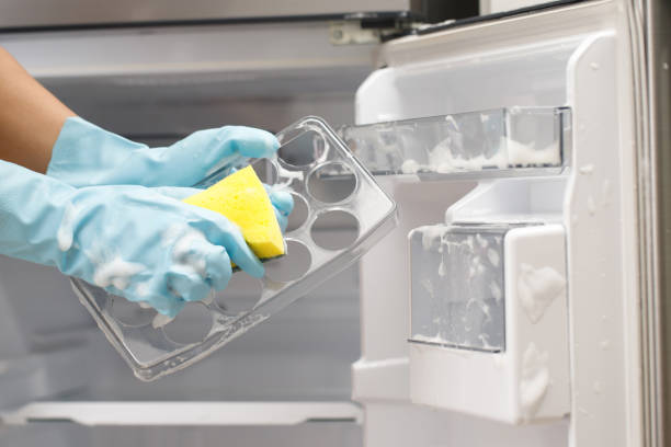 istock Employees use a cloth to clean the refrigerator. 1711369666