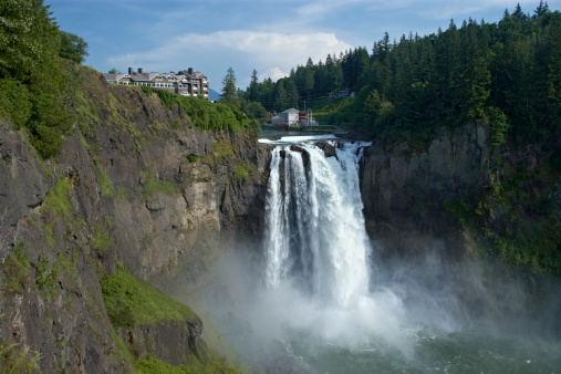 A cloud of mist rises from the base of beautiful and awe-inspiring Snoqualmie Falls.