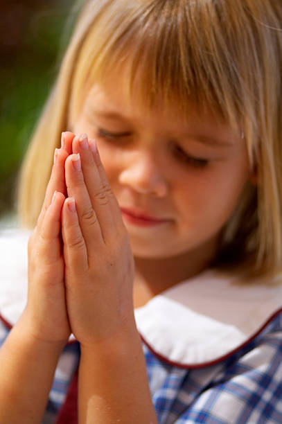 Praying child stock photo