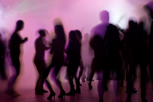 Dancing people in night club
