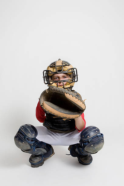baseball catcher in studio young baseball catcher photographed in studio catchers mask stock pictures, royalty-free photos & images
