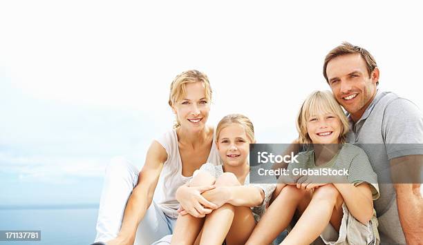 Portrait Of A Family Smiling Stock Photo - Download Image Now - 20-24 Years, 20-29 Years, 6-7 Years