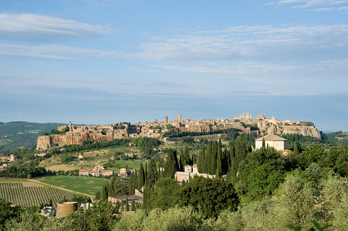 Matera, Basilicata, Italy - 29 october 2023: The Cathedral of the Madonna della Bruna, in Apulian Romanesque style, was built in the 13th century on the highest spur of the Civita that divides the two Sassi, on the area of ​​the ancient Benedictine monastery of Sant'Eustachio, one of the two patron saints of the city. On the outside, note the sixteen-ray rose window and the 52 meter high bell tower; Inside, noteworthy are a Byzantine fresco of the Madonna della Bruna, a sixteenth-century nativity scene by the sculptor Altobello Persio and a fresco depicting the Final Judgement.