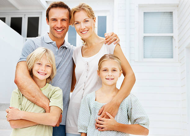 istock Happy parents posing with children 171137896
