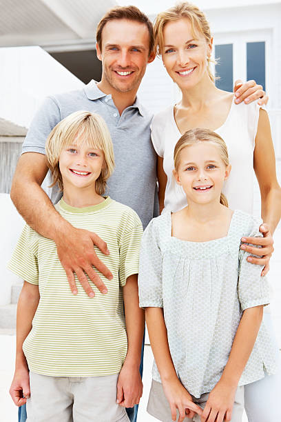 istock Happy parents with children posing at camera 171137897