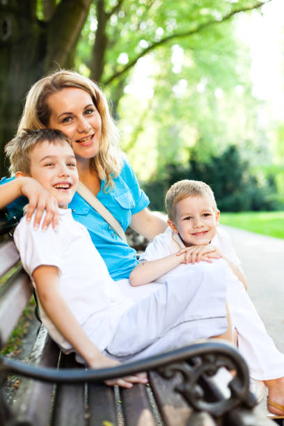 istock Mother and sons in the park 171138031