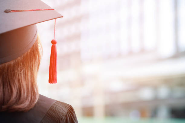 close up hat young women  backside group crowd of new graduates during commencement. Concept education congratulation. Graduation Ceremony in University