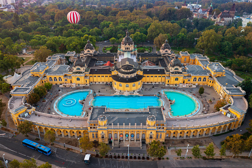 Budapest, Hungary - Aerial view about the Szechenyi thermal bath next to City park. Ballonfly at the background.