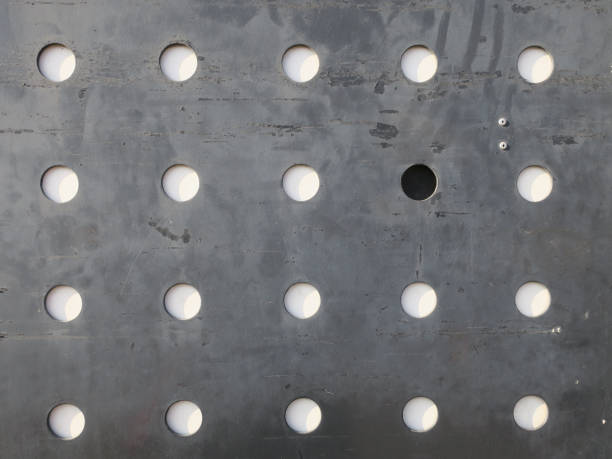 an iron plate with 25 holes and it's shadows