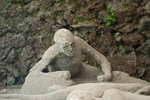 eruption victim of Vesuvius in Pompeii (Some plaster casts of victim of the eruption still in actual Pompeii)The city is mainly famous for the ruins of the ancient city of Pompeii, located in the frazione of Pompei Scavi. pompeii ruins stock pictures, royalty-free photos & images
