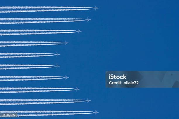 Airplanes In A Blue Sky With Vapor Trail Air Traffic Stock Photo - Download Image Now