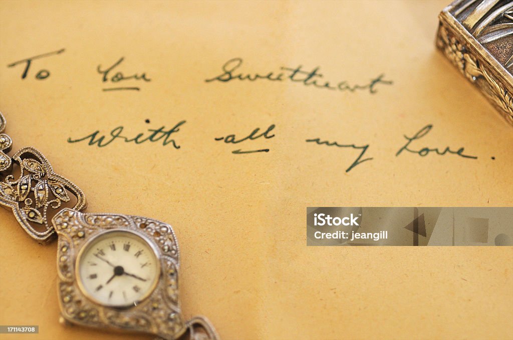 old love letter 1940s loving dedication on old paper and with the characteristic underlining and capital letters of that period. Old fashioned silver watch and trinket box with note.A wide variety of Christmas images here[/img][/url] Art Deco Stock Photo