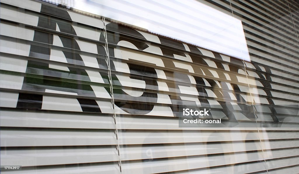 Agency text on the glass window Real Estate Office Stock Photo