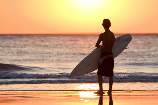 Dawn on a beach of surfers in the pacific ocean. mountain ecuador