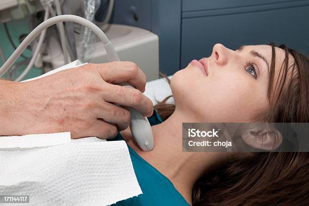 Doctor Is Giving Beautiful Young Patient An Ultra Sound Stock Photo - Download Image Now