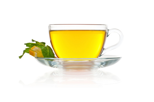 Creative layout made of cup of black tea and lemon on a white background. Top view.