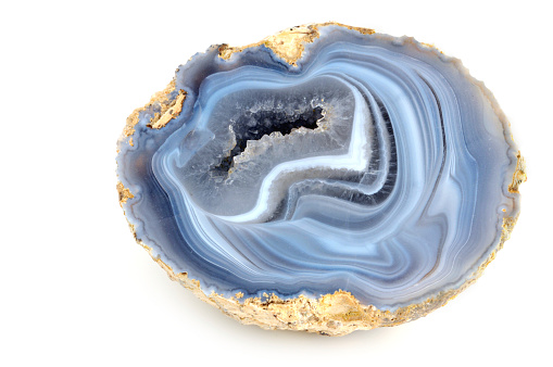 blue banded agate on white background. inside with small quartz crystalsSee also my other Mineral/ Crystal and Fossil images: