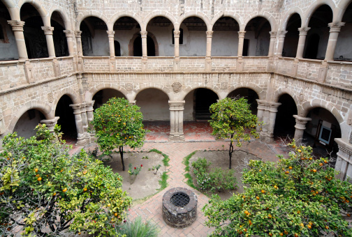 Sevilla, Spain – March 13, 2022: Gardens of Reales Alcázares de Sevilla, a palace decorated in Arabic style.