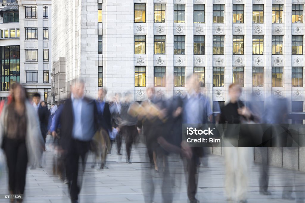 Blurred Business Commuters Walking in Front of Office Building, London blurred and defocused business people walking in front of the office buildingsClick here to view more related images: Businessman Stock Photo