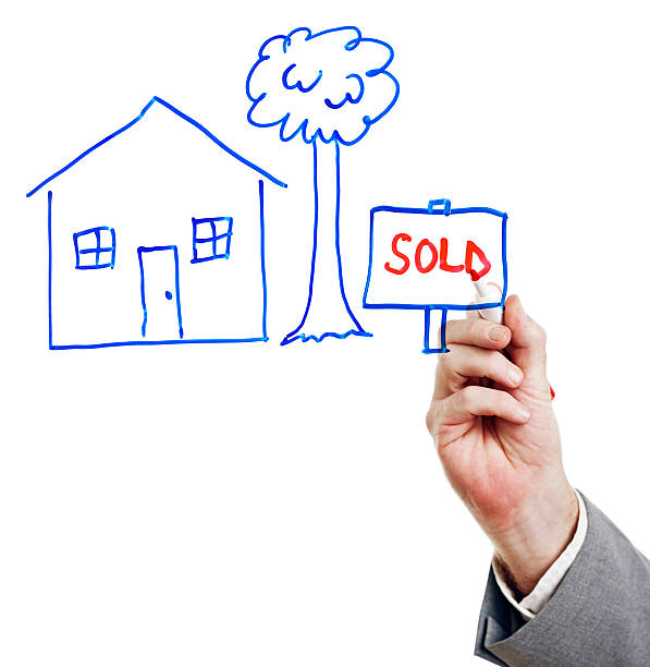 Hand writes SOLD next to drawing of house on perspex A suited man's hand writes 'SOLD' in red on a transparent perspex board, next to a drawing of a house. Is he the Real Estate Agent, a prospective buyer or the owner Shot with Canon EOS 1Ds Mark III. perspex stock pictures, royalty-free photos & images