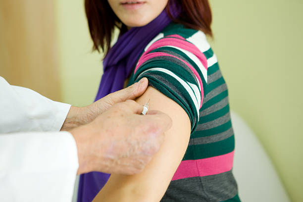 istock Nurse at work...injecting vaccine for flu 171145150