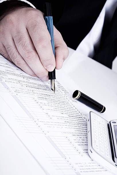 istock Businessman Signing Form 171145240
