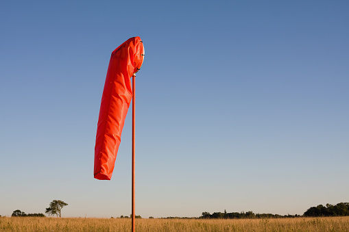 A windsock against a blue clear sky in Norfolk, Virginia